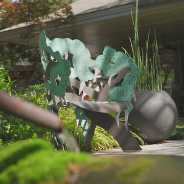 video of spanish moss bench close up metal garden bench sculptural branch detail teal green patina outdoor seating craftsmanship